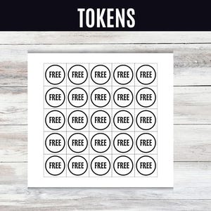 May include: A white sheet with a grid of black-bordered circles, each labeled "FREE" in a bold font. The word "TOKENS" is at the top in a bold font. The background is a light wood grain.