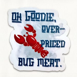 May include: A sticker featuring a red lobster illustration and the text "OH GOODIE, OVER-PRICED BUG MEAT" in blue. The background has a watercolor effect. The sticker is white with a rounded edge.