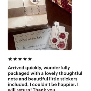 May include: A handwritten note with the text "A little note from Robyn: H: SHERRI, JUST WANT YOU MUCH I APPRECIATE" is included with a stack of white note cards and a set of floral stickers.
