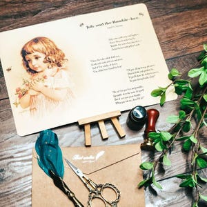 May include: A vintage-style illustration of a young girl holding flowers, with the poem "July and the Bumble-bee." A teal feather quill, gold scissors, and a brown envelope with "Best wishes" are also visible.