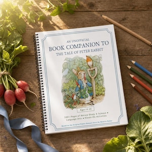 May include: A spiral-bound book titled An Unofficial Book Companion to The Tale of Peter Rabbit, featuring a watercolor illustration of a rabbit in a blue jacket holding a carrot, a bird, and a garden tool, with text indicating ages 4-10.