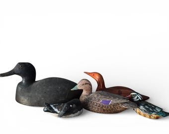 Vintage houten lokvogels en houtsnijwerk