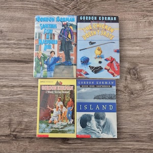 May include: Four paperback books by Gordon Korman. The titles are "Something Fishy at Macdonald Hall", "The Chicken Doesn't Skate", "I Want To Go Home!" and "Island: Book One: Shipwreck".