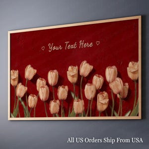 May include: A framed canvas art piece featuring a field of peach-colored tulips against a deep red background. The text "Your Text Here" is displayed in a cursive font. The artwork is encased in a light brown wooden frame.