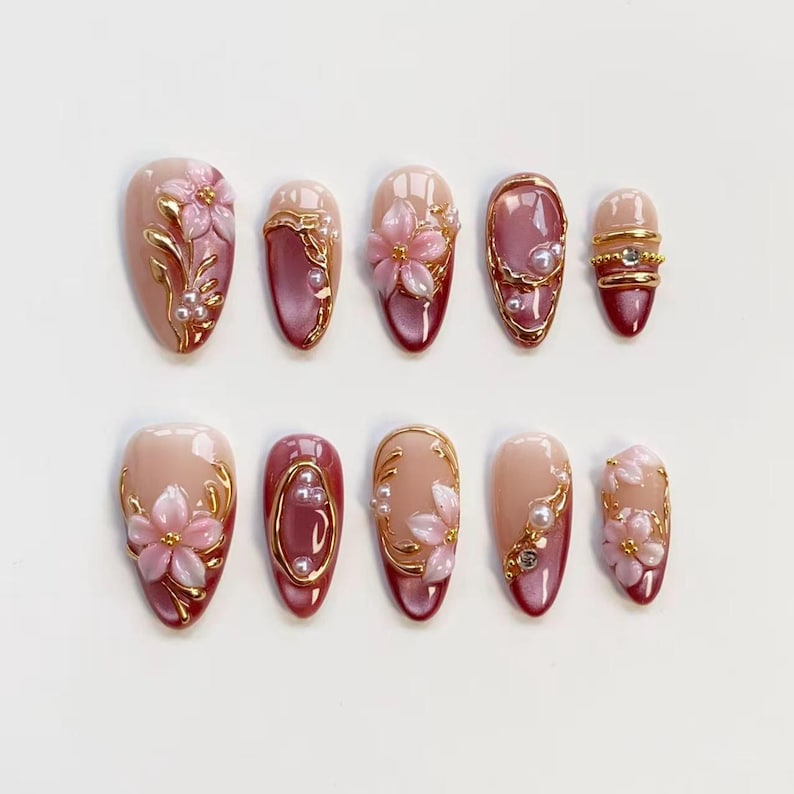 May include: A white ceramic mug with a black handle and the text "But First, Coffee" in a black, bold font. The mug is on a white surface.