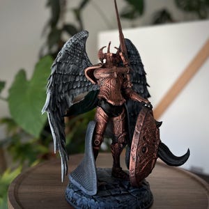 May include: A set of three ceramic mugs with a speckled, matte finish. The mugs are in shades of cream, light gray, and dark gray. Each mug has a simple, minimalist design, perfect for coffee or tea.