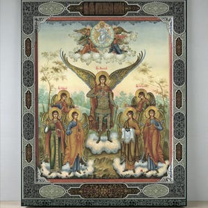 May include: A framed religious icon depicting a central winged figure, surrounded by other angels. The artwork is in a traditional style with gold detailing and a decorative border. The color scheme includes blues, golds, and earth tones, typical of religious iconography.