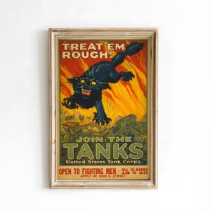 May include: Vintage framed poster with a black cat leaping against a fiery background. The poster reads "TREAT 'EM ROUGH! JOIN THE TANKS" and promotes the United States Tank Corps. The poster is in a gold frame.