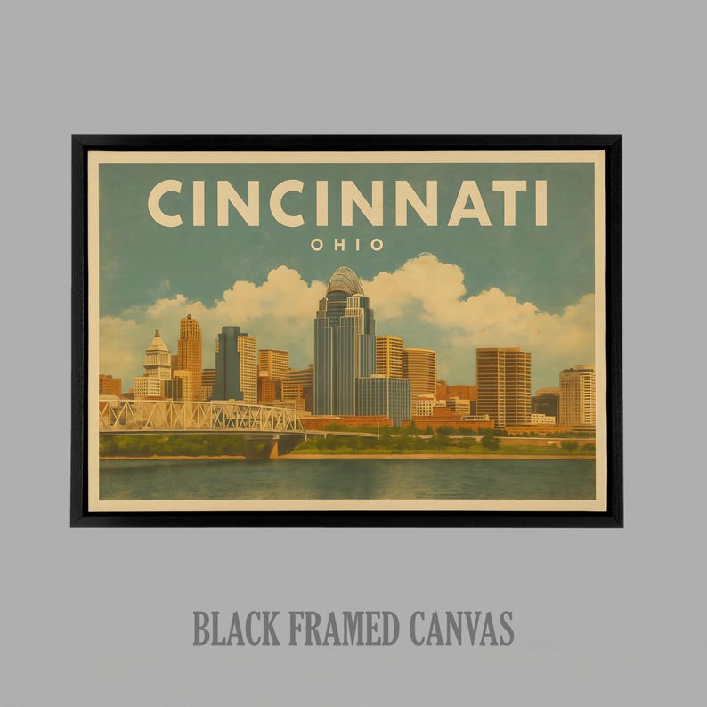 May include: A framed canvas print with a vintage illustration of the Cincinnati, Ohio skyline. The artwork depicts the city's buildings, a bridge, and the Ohio River under a blue sky with clouds. The text "CINCINNATI OHIO" is at the top.
