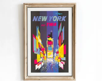 May include: Framed vintage travel poster for New York City, with a colourful, geometric depiction of the city at night. The poster includes the text "NEW YORK" and "FLY TWA" with an image of an aeroplane.