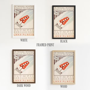 May include: Framed print featuring a vintage Olympic bobsled run poster. The poster has a red and white bobsled racing down a snowy track. Text includes "Up Where Winter Calls to Play" and "Lake Placid."