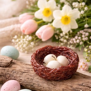 Easter bird nest candle with eggs on rustic wood, spring decor centerpiece