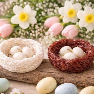 Hand holding Easter nest candle with pastel eggs, handmade spring wax decor