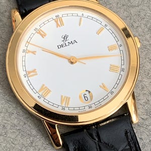 Nice vintage watch Delma for men Swiss made date calendar, used excellent condition