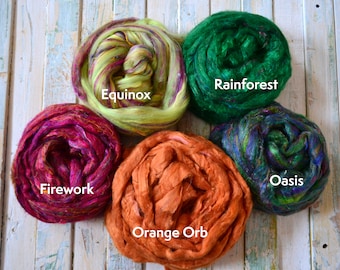 May include: Five balls of colorful fiber, each with a different name: Equinox, Rainforest, Oasis, Orange Orb, and Firework.