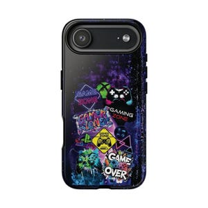 May include: Black phone case with a gaming theme. The case has a galaxy background and gaming graphics, including controllers and the words "Game Zone," "Gamer Zone," and "Game Over."