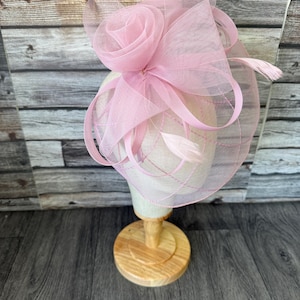 May include: A set of three ceramic mugs with a speckled, matte finish in cream, light grey, and dark grey. Each mug has a simple, minimalist design and a rounded handle.