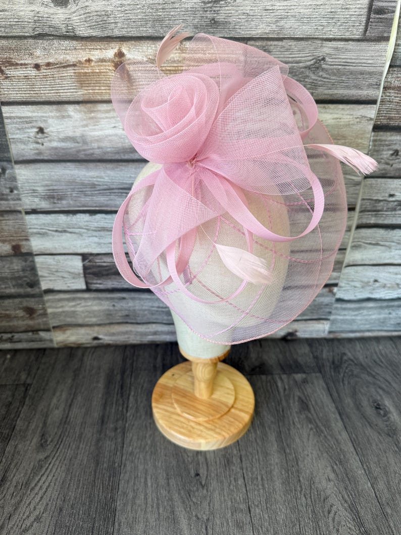 May include: A set of three ceramic mugs with a speckled, matte finish in cream, light grey, and dark grey. Each mug has a simple, minimalist design and a rounded handle.