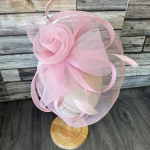 May include: A set of three ceramic mugs with a speckled, matte finish. The mugs are in shades of cream, light grey, and dark grey. Each mug has a simple, minimalist design, ideal for coffee or tea.