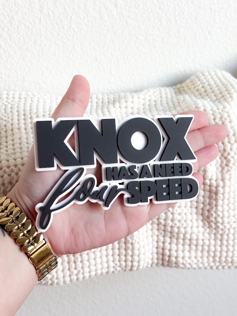 May include: Black and white vinyl sticker set with the text "Knox has a need for speed".