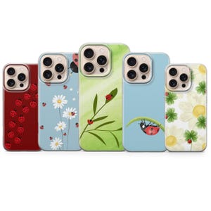 May include: Five phone cases with nature-themed designs. The cases feature ladybugs, daisies, and other floral elements. Colors include red, blue, green, and yellow. The cases are designed to fit a smartphone.