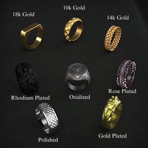 K&ouml;nnte beinhalten: Eine Sammlung von Ringen in verschiedenen Stilen und Ausf&uuml;hrungen, darunter 18 Karat Gold, 10 Karat Gold, 14 Karat Gold, ros&eacute;vergoldet, vergoldet, oxidiert, poliert und rhodiniert. Die Ringe zeigen verschiedene Designs, von geometrischen Mustern bis hin zu floralen Motiven.