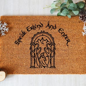 May include: A set of three ceramic mugs with a speckled, matte finish. The mugs are in shades of cream, light gray, and dark gray. Each mug has a simple, minimalist design, perfect for coffee or tea.