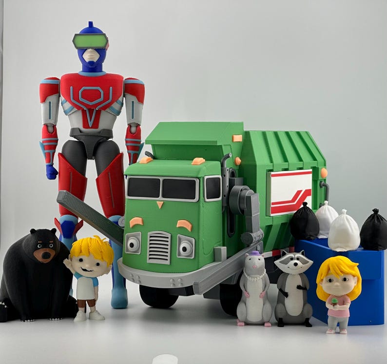 May include: A collection of plastic figures including a tall blue, red, and white robot, a green garbage truck, a black bear, a raccoon, a rat, two small children with blonde hair, and several small white and black trash bags.