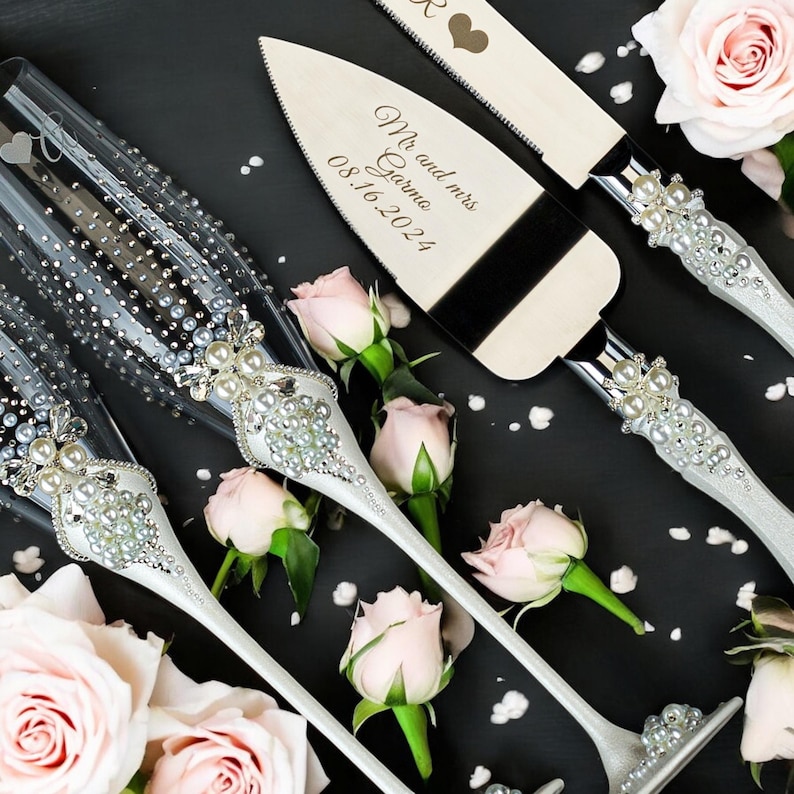 personalized wedding toast set, pearl champagne flutes, wedding cake server, engraved wedding glasses, bride and groom gift, pearl wedding decor, wedding reception accessories, custom wedding gift, champagne toast glasses, elegant wedding keepsake, wedding celebration set, pearl bridal accessories, wedding table decor, personalized flutes, wedding day details