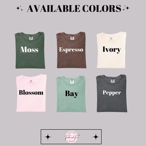 May include: Six folded t-shirts in various colors: moss, espresso, ivory, blossom, bay, and pepper. The words "AVAILABLE COLORS" are at the top. The brand name is at the bottom.