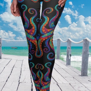 May include: Black leggings with a colorful octopus pattern. The octopus tentacles are in shades of blue, green, orange, and purple.
