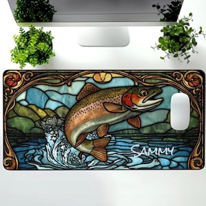 May include: A rectangular mousepad featuring a stained-glass style design with a leaping trout. The fish is brown, orange, and red, set against a blue and green water and landscape. The name "SAMMY" is written in white.