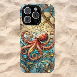 May include: A phone case with a stained glass design featuring an octopus with red, orange, and blue tentacles. The background is a blue and gold design with a white and gold pattern.
