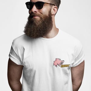 May include: White t-shirt featuring a pink pig graphic and the word "SNORT" in yellow. The shirt is worn by a person with a long beard and sunglasses.