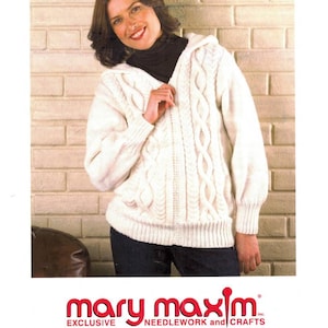 May include: A woman wearing a cream-colored Aran hooded jacket with a cable knit design. The jacket has a hood and a zipper closure. The image includes the text "No. 99399-400-1N Aran Hooded Jacket Sizes: 32, 34, 36, 38, 40, 42, 44" and the Mary Maxim logo.