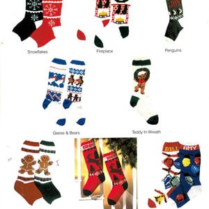 May include: A collection of Christmas stockings with various designs. The stockings include snowflakes, fireplaces, penguins, geese and bears, a teddy bear in a wreath, gingerbread people, deer, and ornaments with Christmas lights. Each stocking has a name.