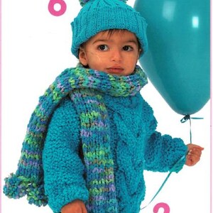 May include: A child wearing a turquoise knit hat with a pom-pom, a matching scarf, and a cable-knit sweater. The scarf has green and purple accents. The child is holding a turquoise balloon. Numbers 6 and 2 are visible in the image.