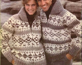 May include: A vintage photograph featuring two people wearing matching zip-up sweaters. The sweaters have a geometric pattern in shades of gray, cream, and brown. The collar is a darker gray. The text "PAT. 6131" is visible in the bottom left corner.