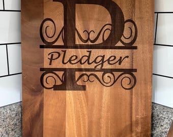 Acacia Cutting Board with monogrammed last name engraved.