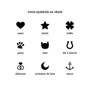 May include: A white background displays nine black graphic symbols with corresponding French text. Symbols include a heart, star, four-leaf clover, paw print, cat silhouette, horseshoe, intertwined rings, crescent moon, and anchor.