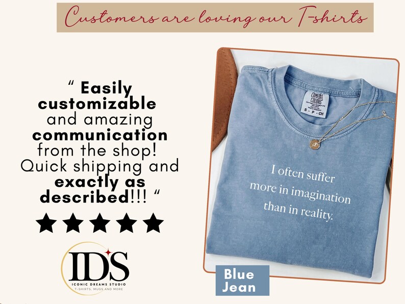 May include: A blue jean t-shirt with the quote "I often suffer more in imagination than in reality." A gold necklace rests on the shirt. The image also includes customer reviews and the shop's logo.
