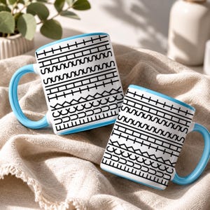 White ceramic hidden message mug with minimalist black pattern design that reveals a funny sarcastic phrase inside, perfect as an office humor gift for coworkers, bosses, friends, or Secret Santa exchanges.