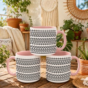 White ceramic hidden message mug with minimalist black pattern design that reveals a funny sarcastic phrase inside, perfect as an office humor gift for coworkers, bosses, friends, or Secret Santa exchanges.