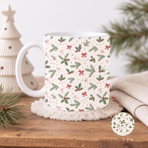 May include: A white ceramic mug featuring a repeating holiday pattern of green pine branches, red holly berries, red bows, and small gold stars. The text "fuck this shit" is printed in a small, cursive font throughout the festive design.