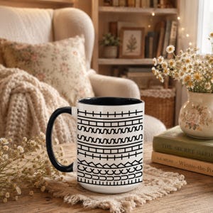 White ceramic hidden message mug with minimalist black pattern design that reveals a funny sarcastic phrase inside, perfect as an office humor gift for coworkers, bosses, friends, or Secret Santa exchanges.