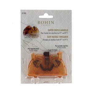 May include: An orange Bohin France Easy Needle Threader on a white background. The package includes text in English and French, indicating it threads needles from size 1 to 11. It also features a built-in thread cutter.