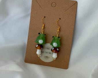Whimsical Frog on Mushroom Dangle Earrings – Handmade Lampwork Glass Beaded Earrings | Cottagecore Jewelry | Nature-Inspired Gift for Her