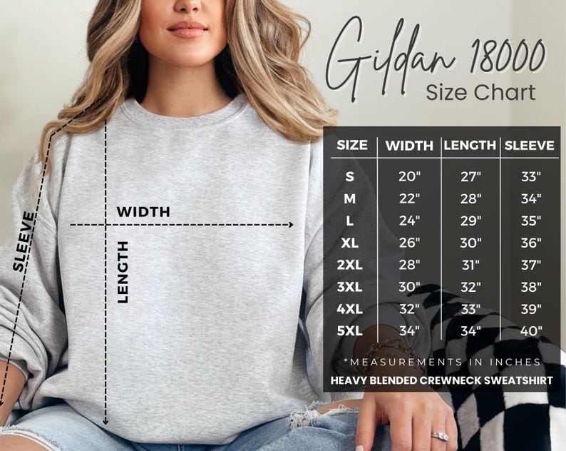 May include: A light gray Gildan 18000 heavy blend crewneck sweatshirt with a size chart. The chart shows measurements in inches for width, length, and sleeve for sizes S through 5XL. The model is wearing the sweatshirt.