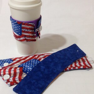May include: A set of three red, white, and blue fabric coffee cup sleeves. The sleeves feature a patriotic design with stars and stripes and the words "Liberty, Peace, Freedom".