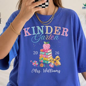 Personalized Kindergarten Teacher Shirt, Comfort Colors Custom Name Tee, 2026 Back to School Book Stack Gift, Classroom Outfit Teacher Shirt